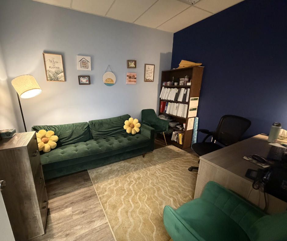 Private counseling room with sofa and desk