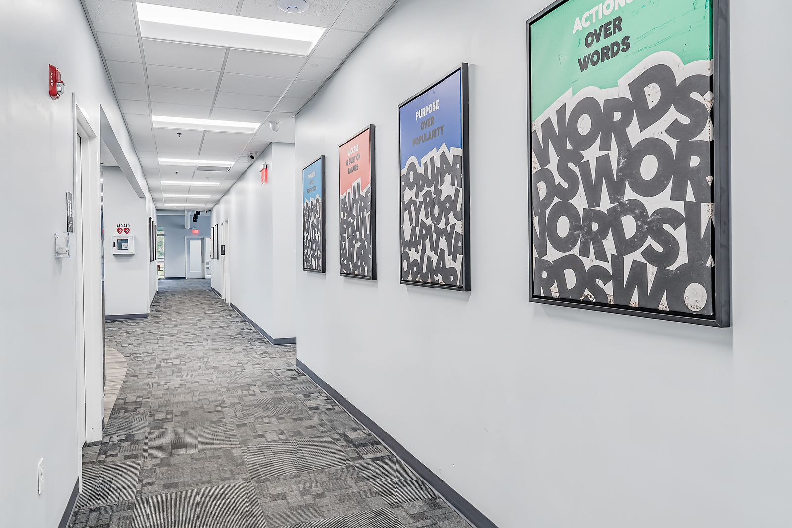 Hallway lined with bold motivational posters