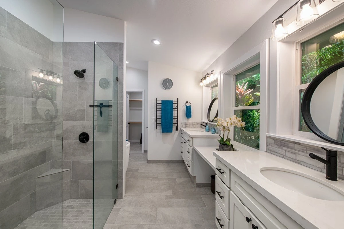 Modern bathroom with dual sinks and glass shower