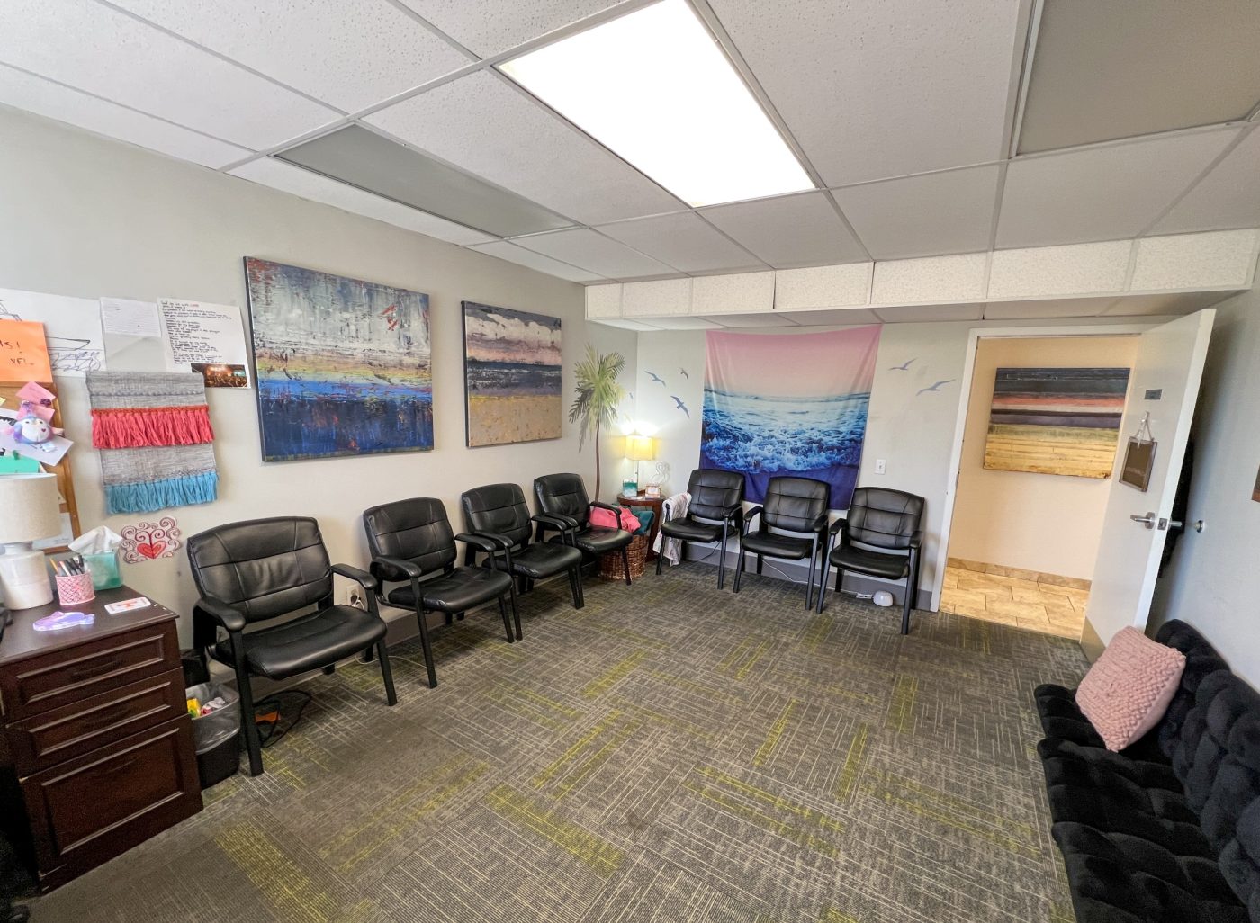 Waiting area with chairs and calming decor for group therapy sessions