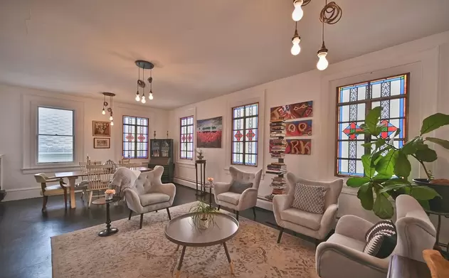 Sitting area with armchairs and stained glass