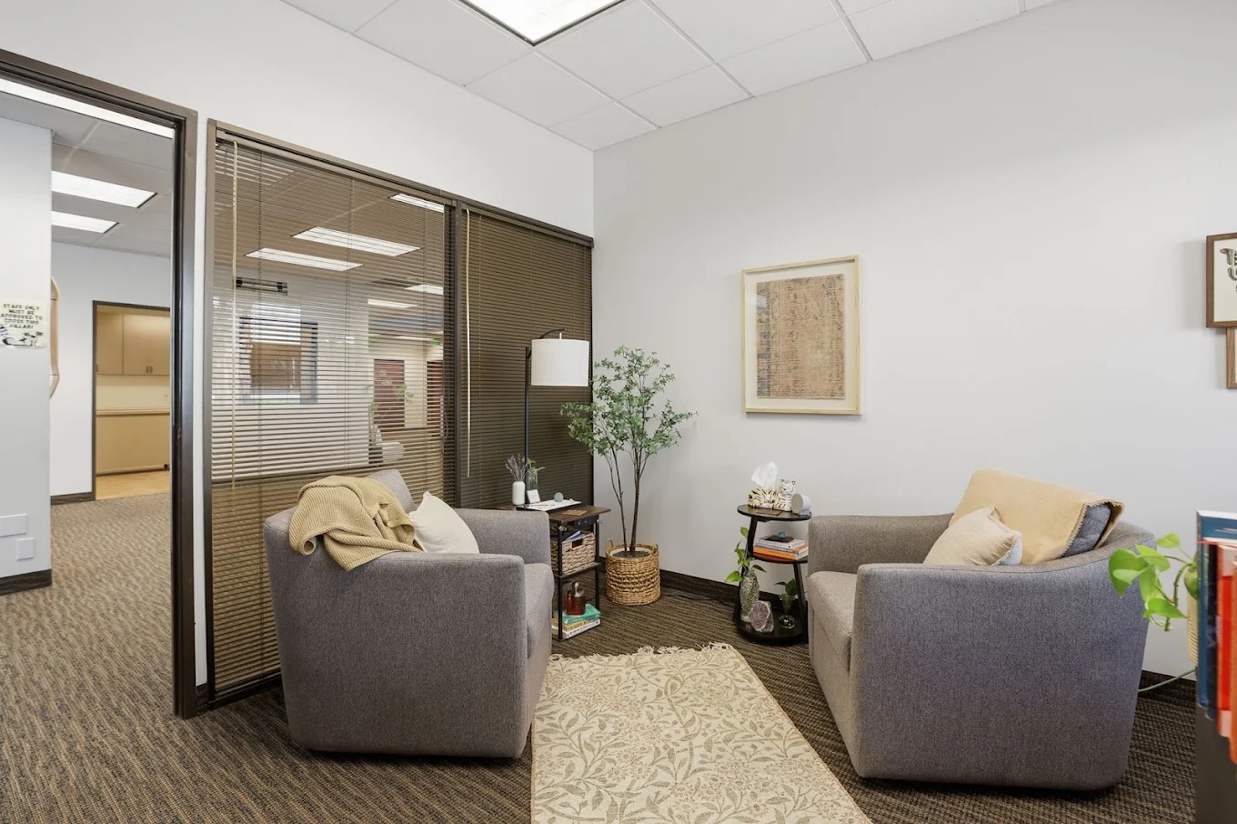 Private consultation room with two upholstered chairs