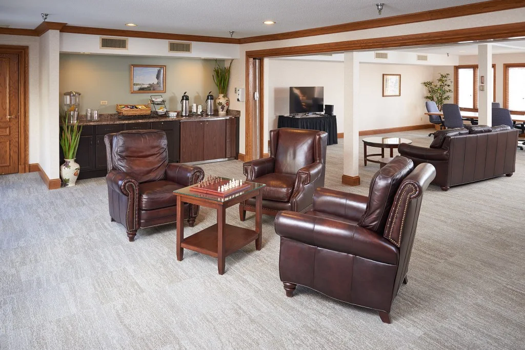 Comfortable lounge with leather chairs and coffee station