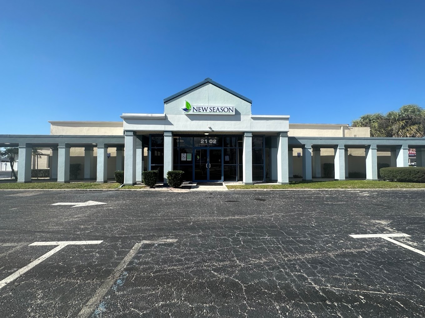 Facility exterior with signage and accessible parking.