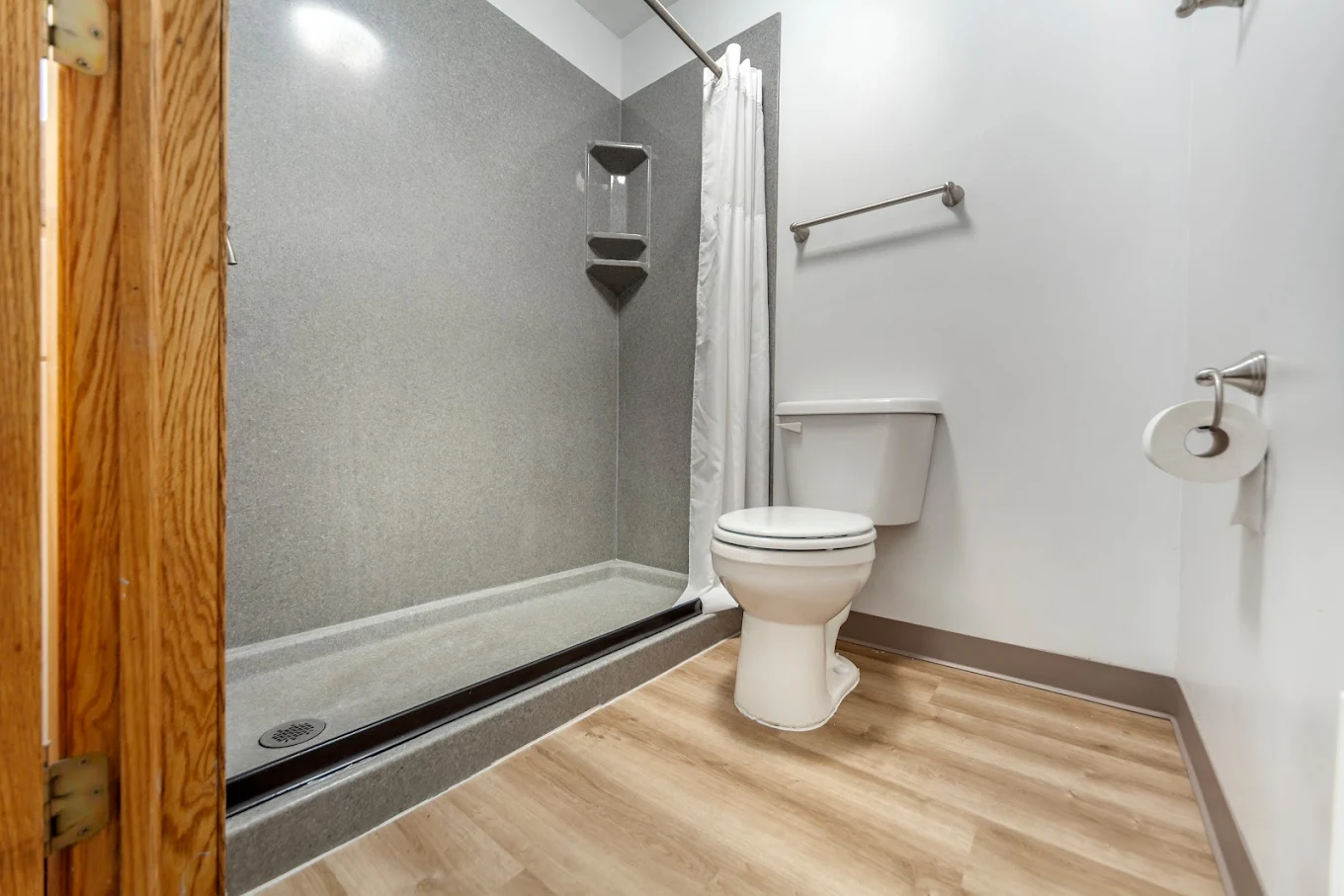 Clean bathroom with shower and toilet