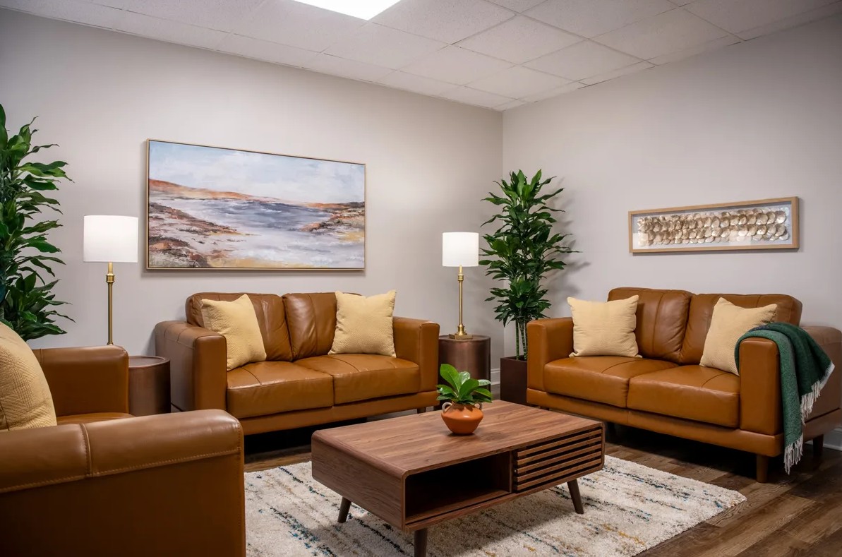 Cozy therapy room with leather sofas and coffee table