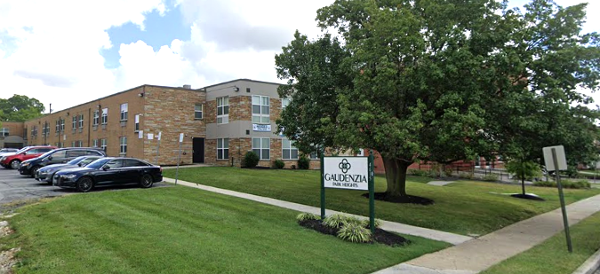 Front view of Gaudenzia Inc. non-hospital residential building with sign and parking lot.