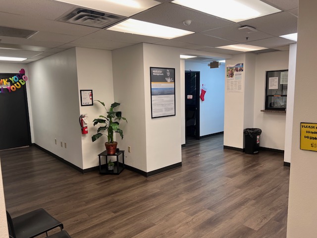 Reception area with medication window and hallway