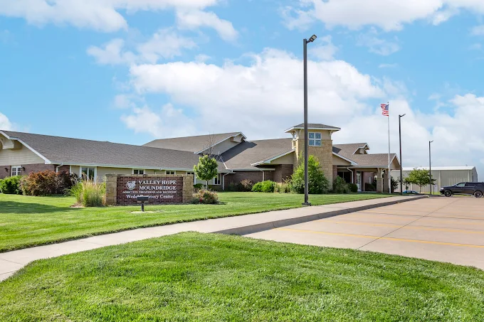Treatment center exterior with lawn and sign