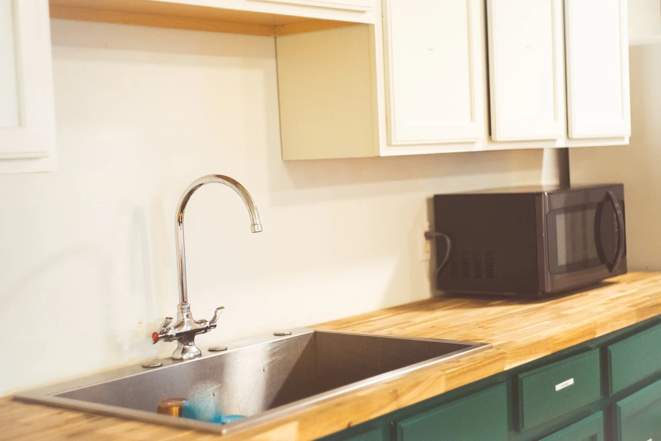 Community kitchen with sink, counter space, and appliances