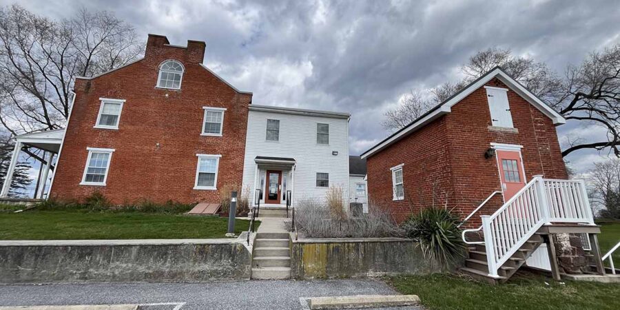 Brick and white-paneled rehab facility building