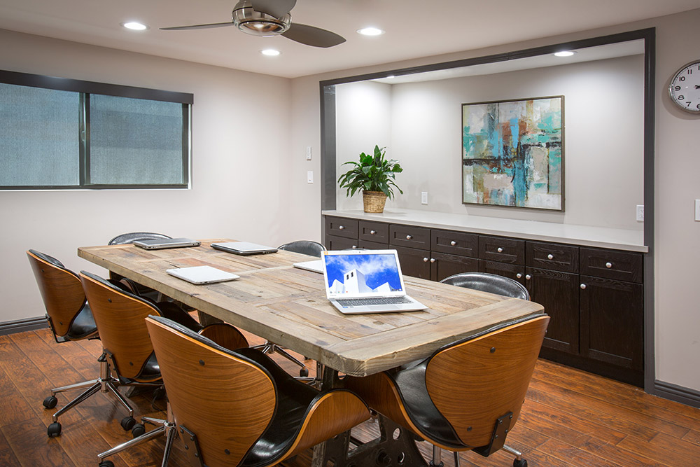 Conference room with rustic wooden table and modern chairs
