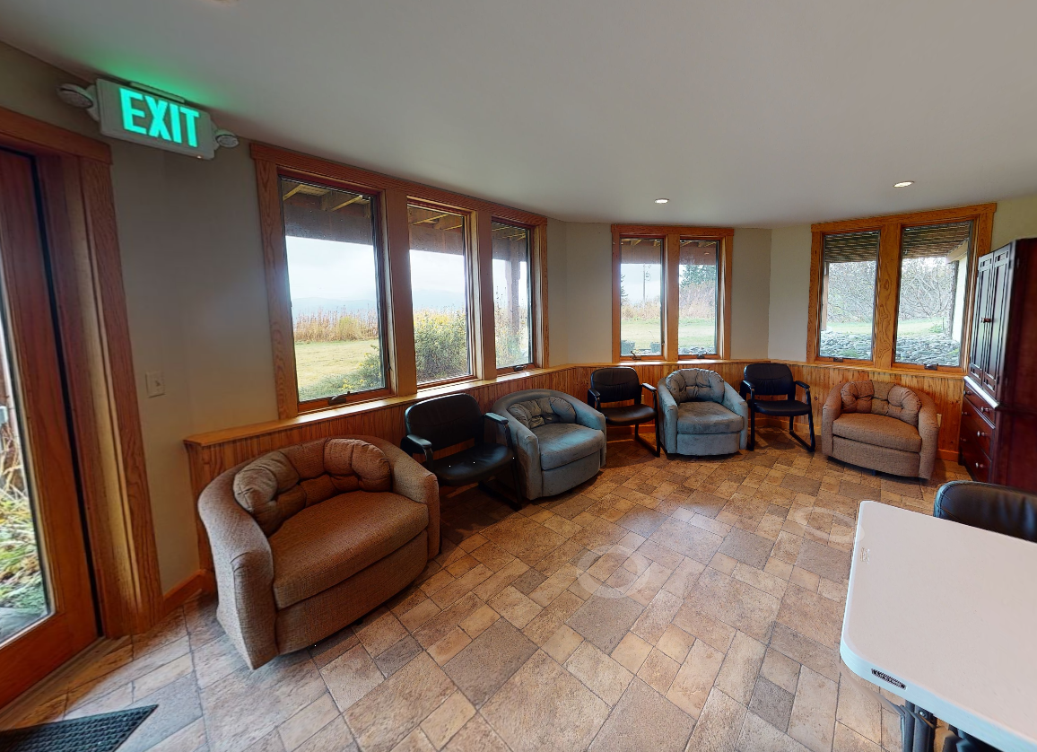 Group room with seating arranged for meetings and activities