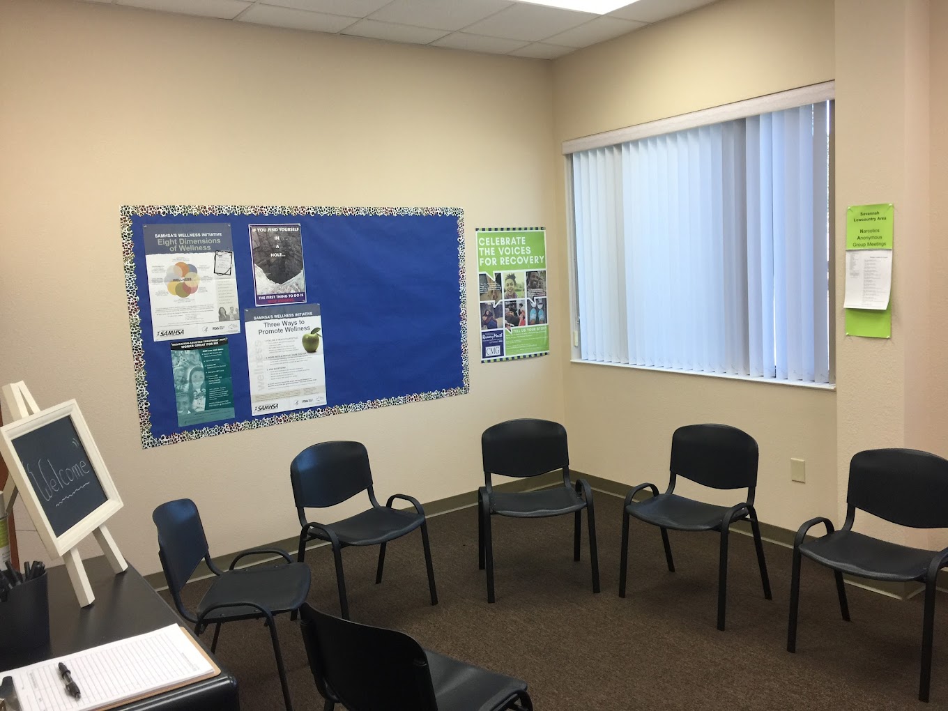 Group therapy room with chairs in a circle.