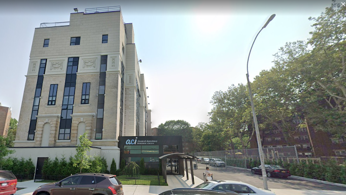 Exterior view of Addiction Care Interventions building and driveway entrance.