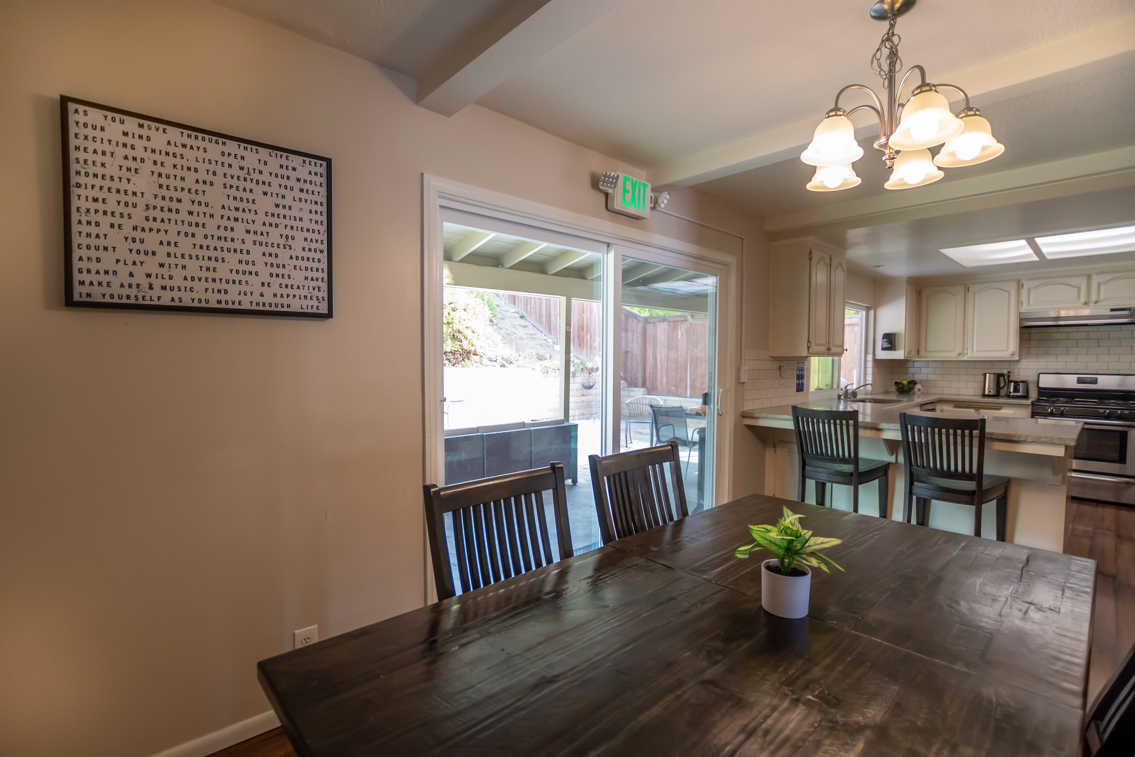 Dining table with view of kitchen bar seating