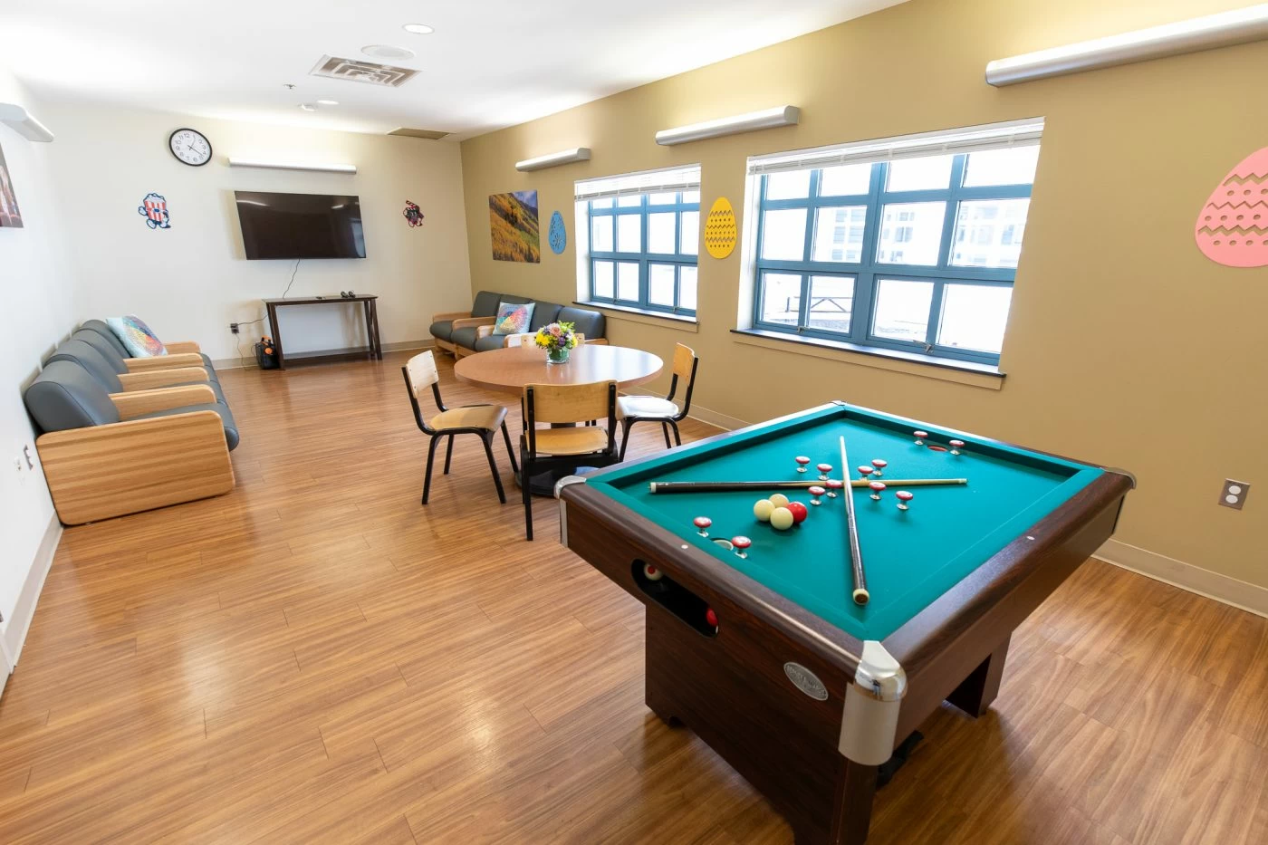 Recreation room with pool table and seating area