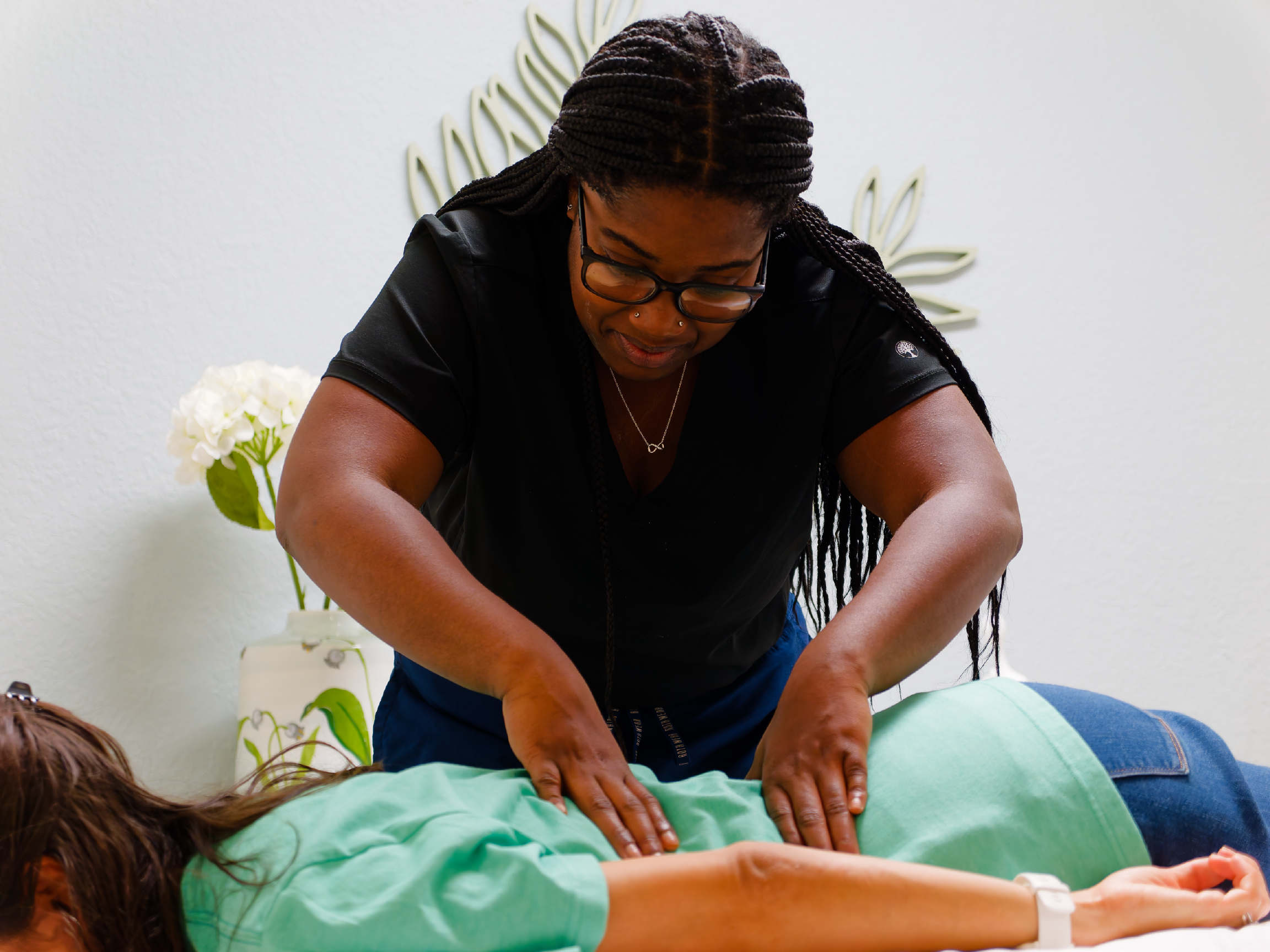 Therapist providing massage therapy to a client