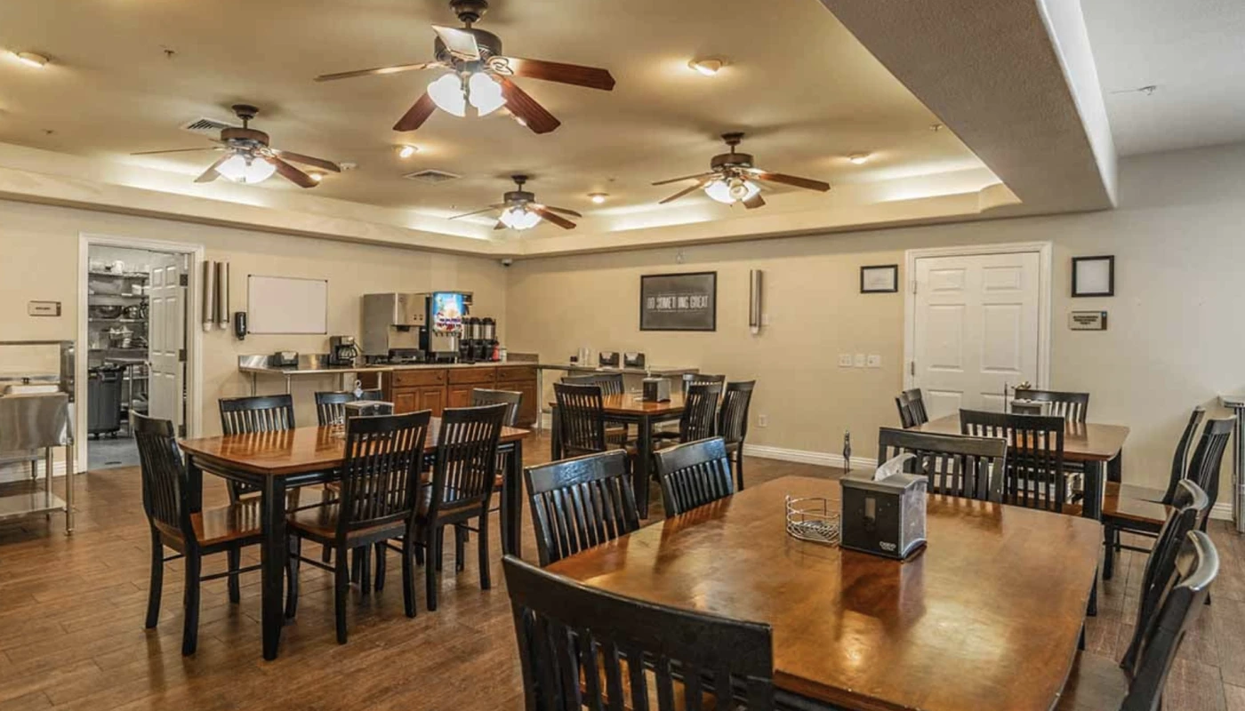 Spacious dining room with wooden tables and chairs