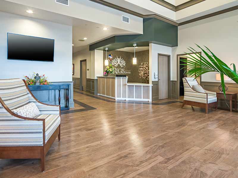 Reception desk with seating in the Mount Regis Center lobby