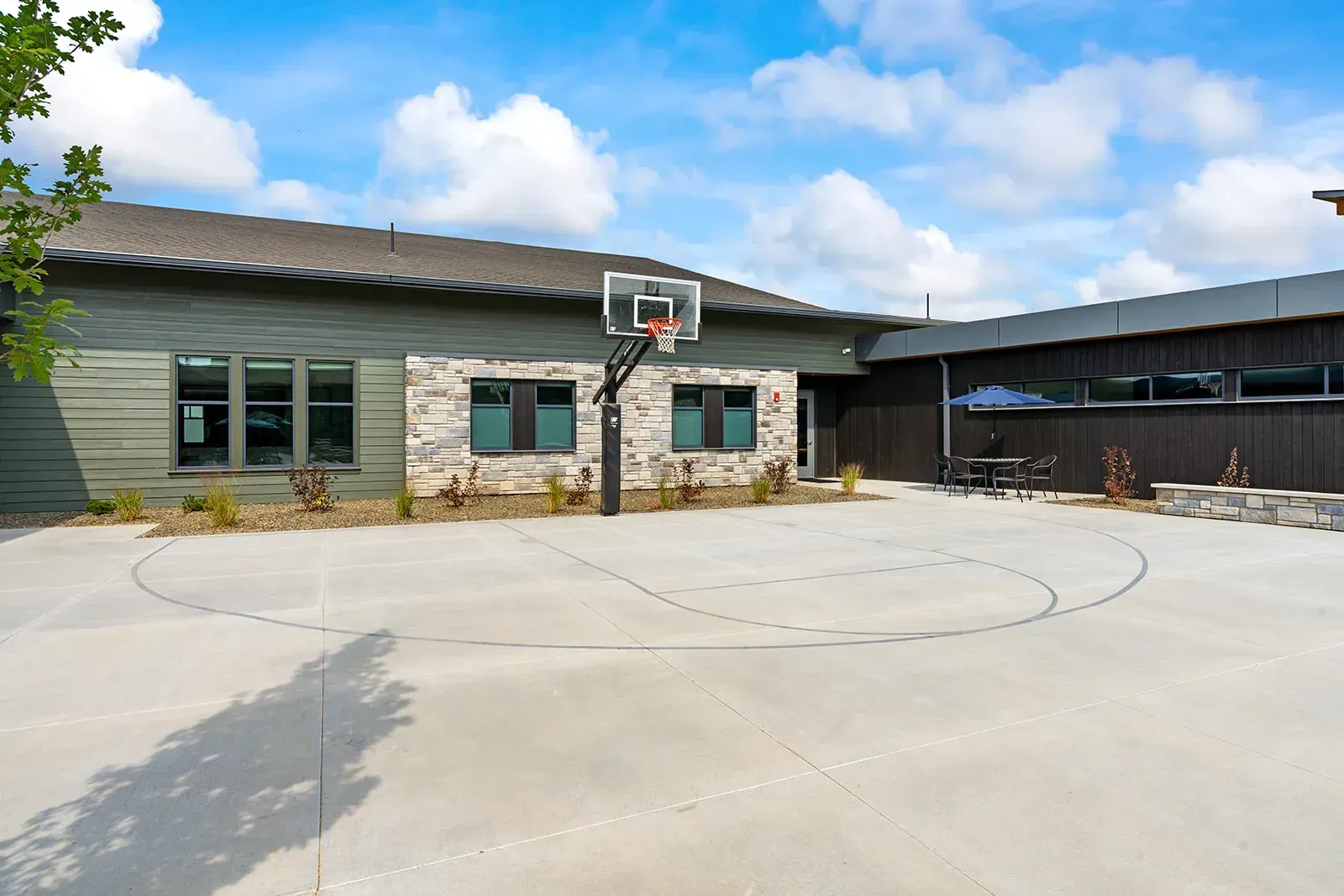 Outdoor basketball court in the facility courtyard
