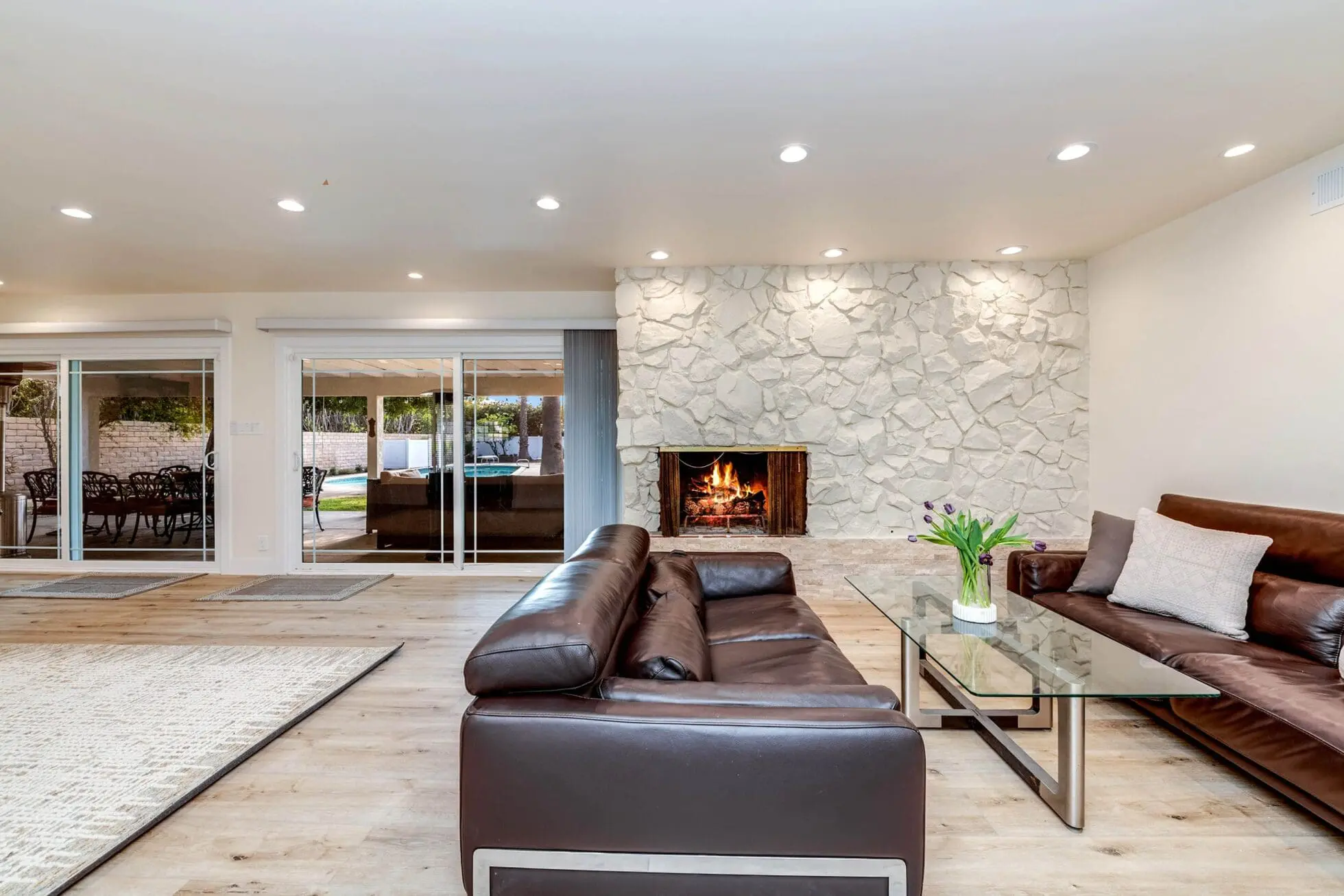 Fireplace lounge with dining area and sliding doors