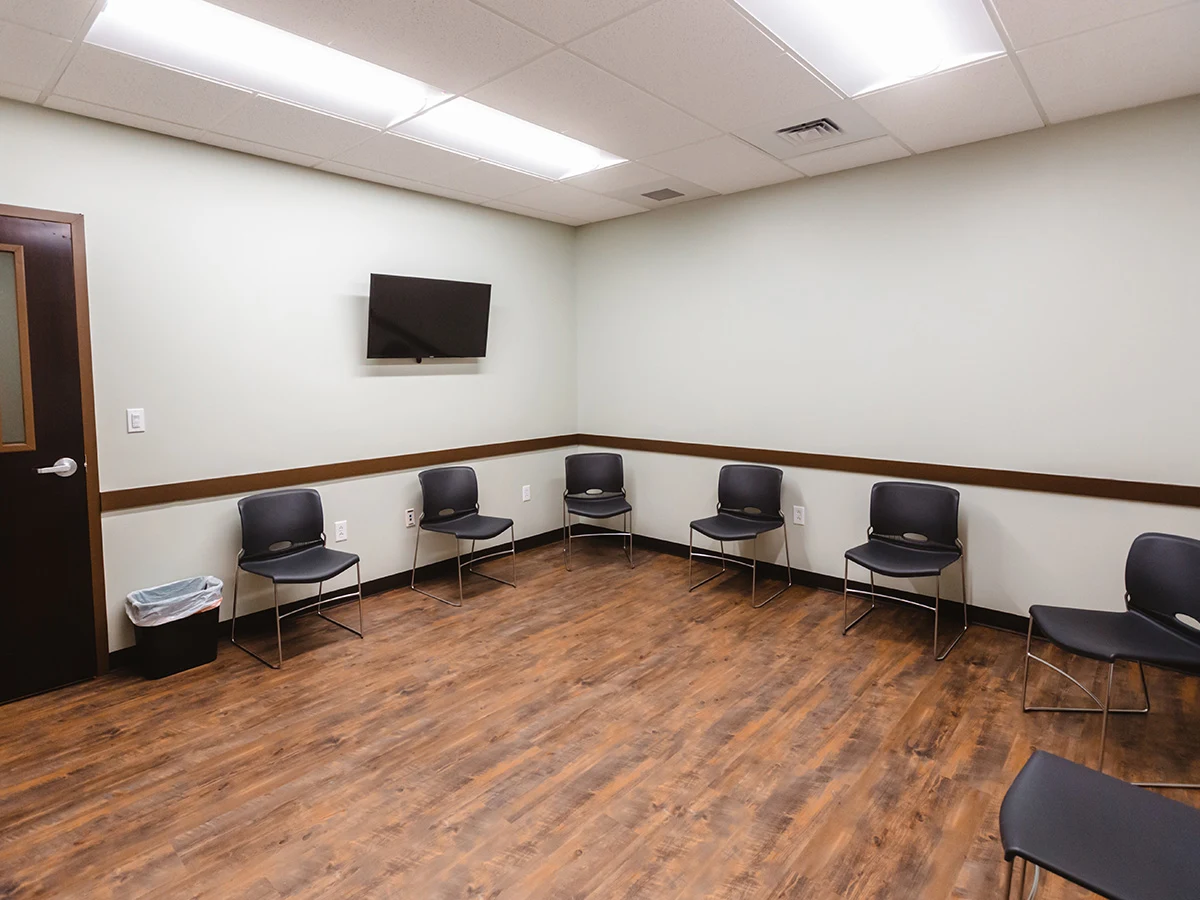 Room with chairs arranged in a circle for sessions