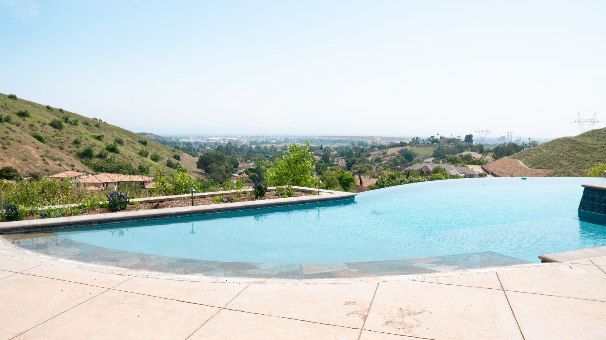 Infinity pool overlooking rolling hills and valley views