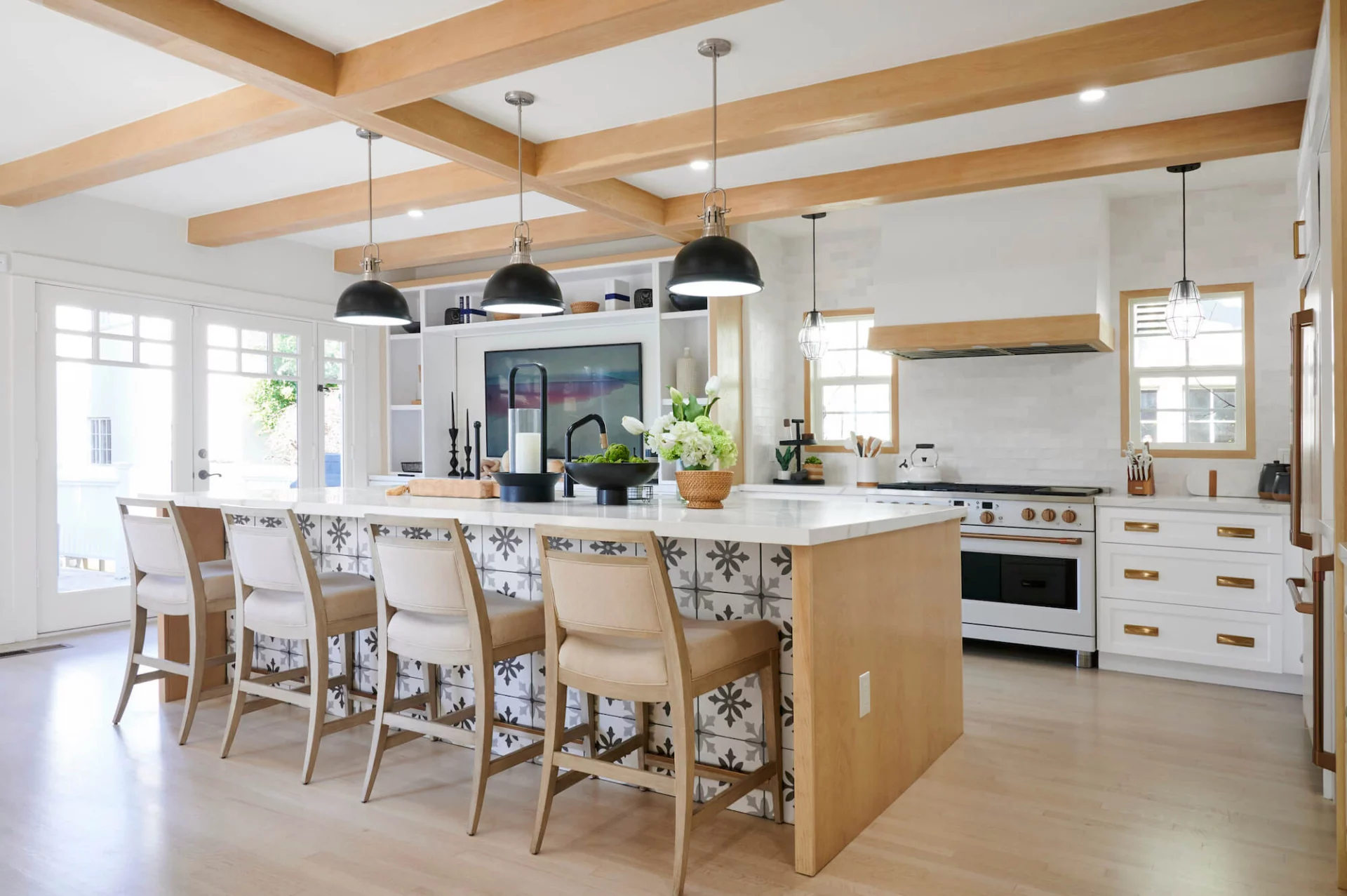 Modern kitchen with island seating and wood beams