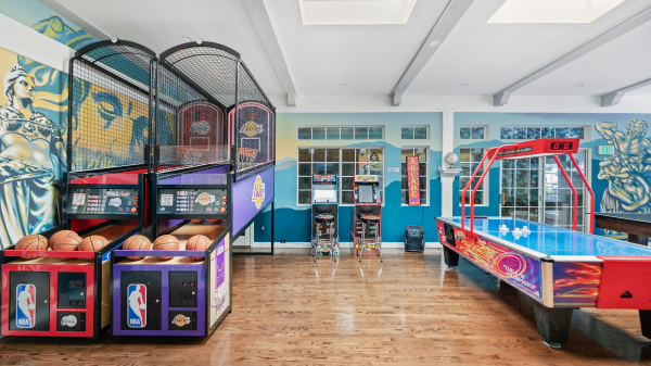 Game room with basketball arcade, air hockey, and murals