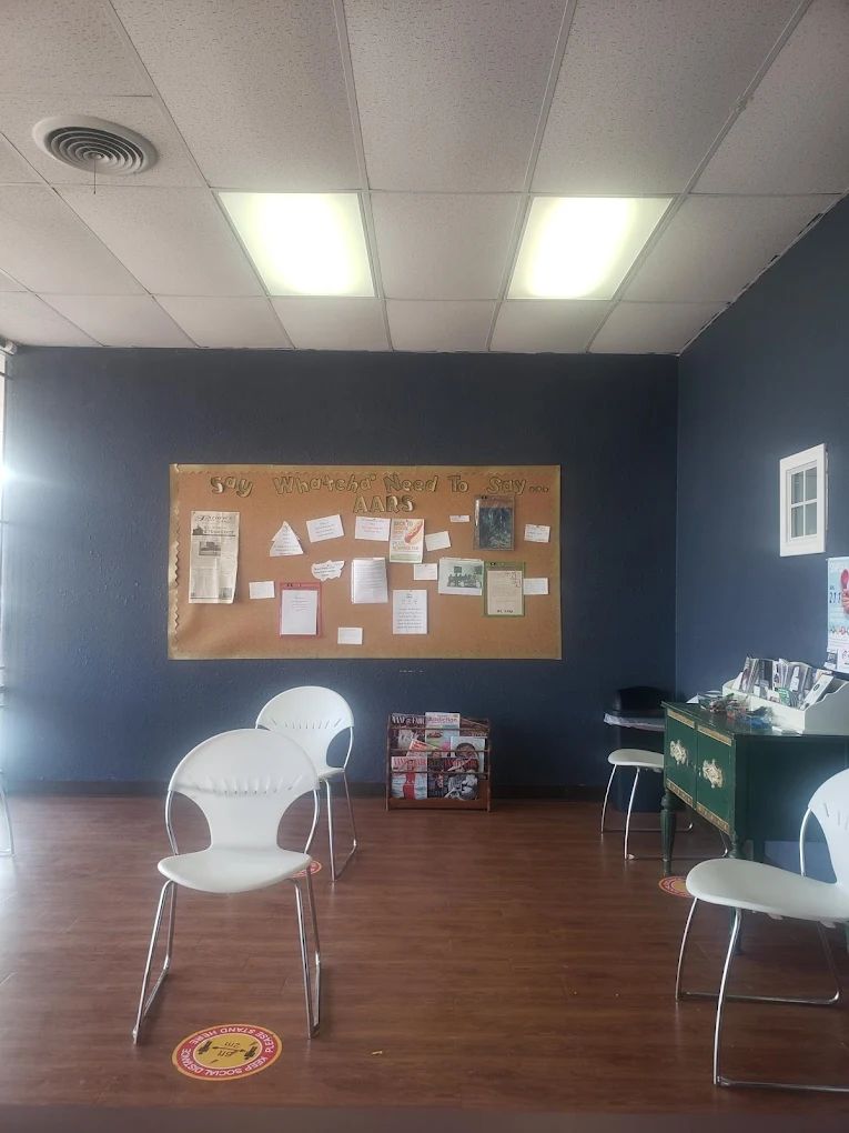 Patient waiting area with chairs and bulletin board