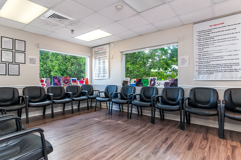 Group therapy room with chairs along the walls.