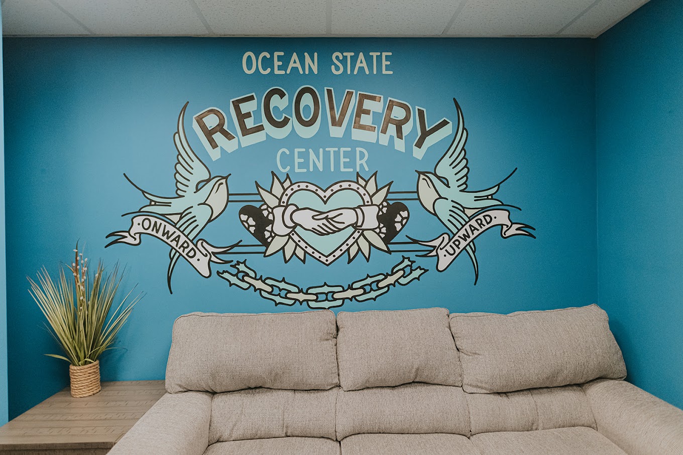 Waiting area atOcean State Recovery Center with a sofa.