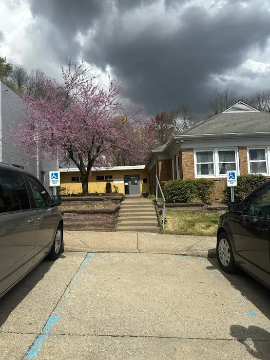 Walkway to Fresh Start Recovery Center with blooming tree