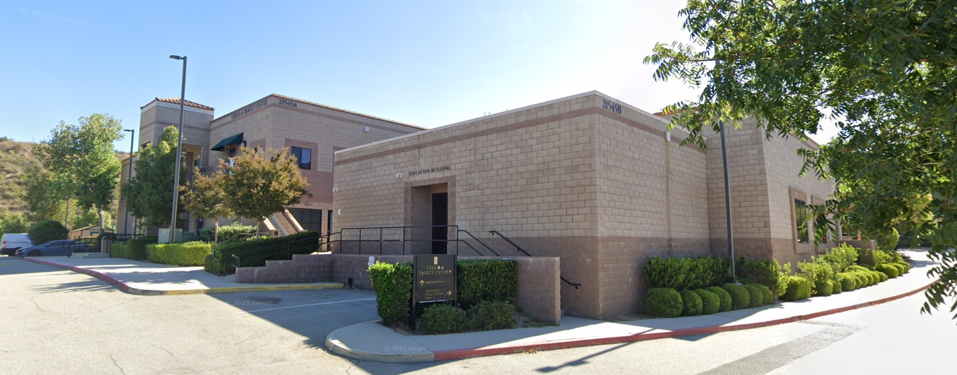 Rear view of the Child & Family Center in Santa Clarita, featuring modern architecture with well-maintained landscaping.