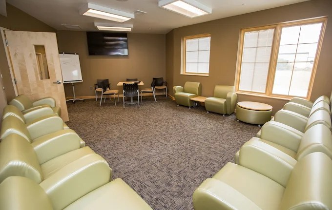 Room with chairs arranged in a circle for group meetings
