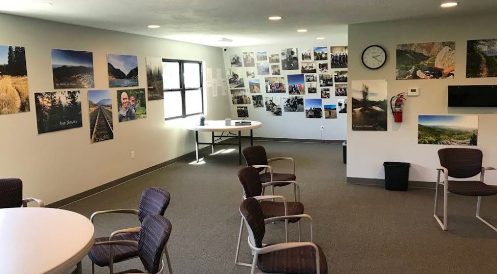 Group meeting space with chairs and motivational wall art