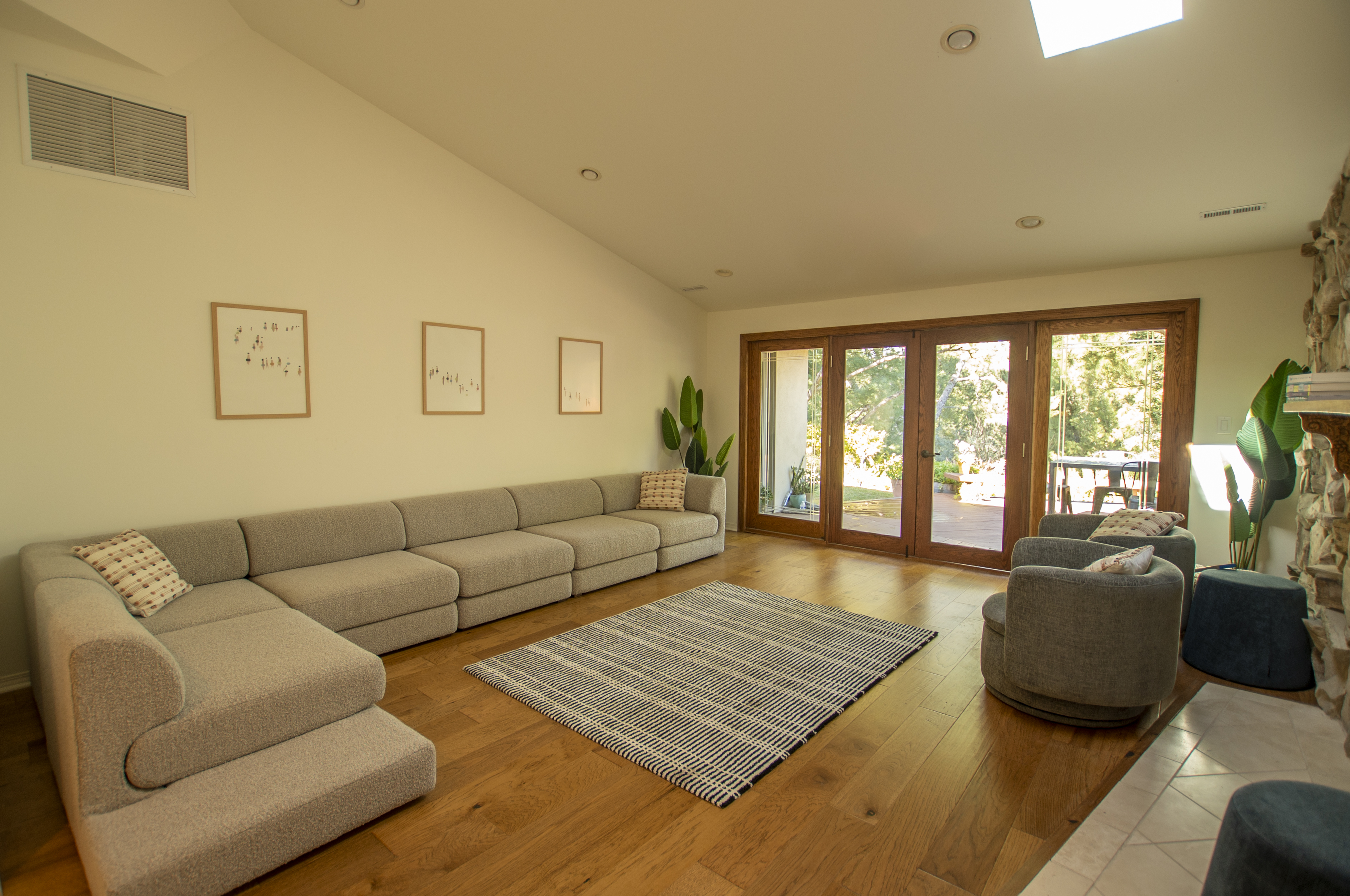 Spacious living room with sectional and glass doors