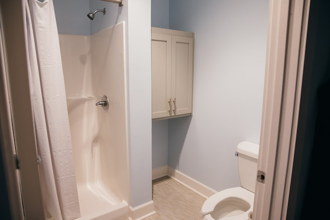 Private bathroom with shower and toilet