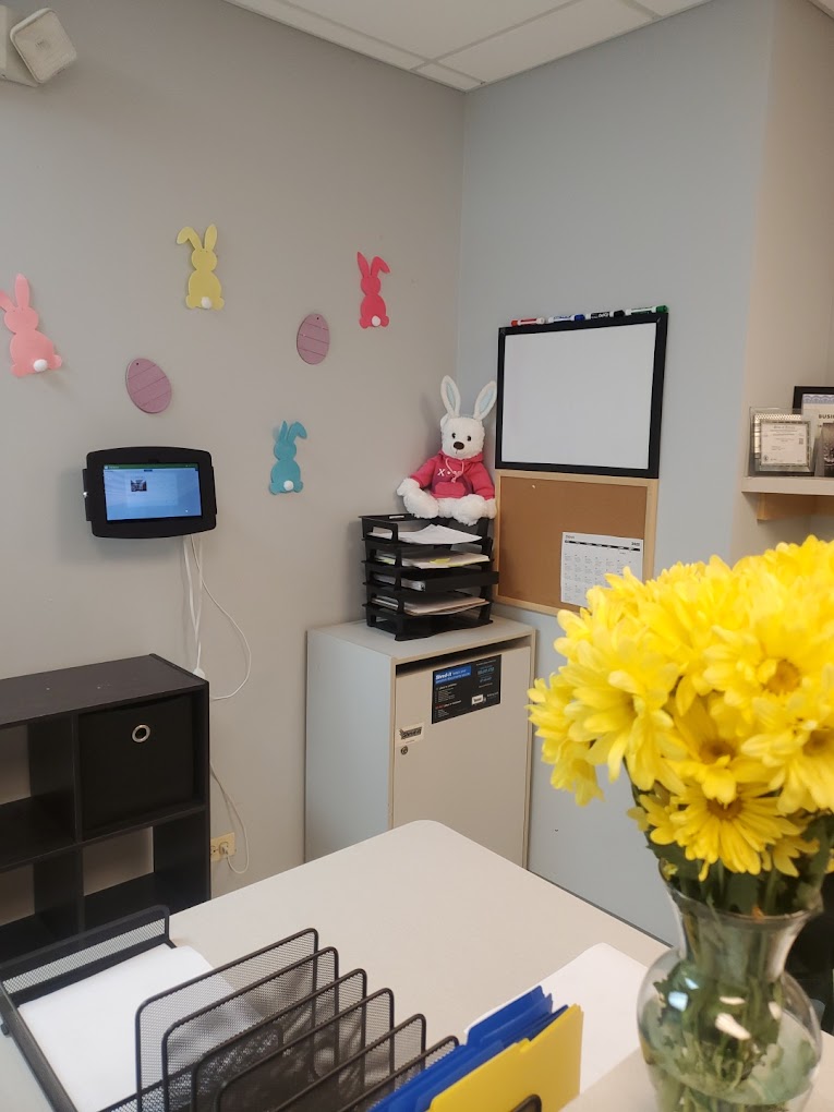 Reception desk with spring decorations and flowers