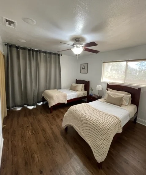 Two twin beds in a cozy shared rehab room
