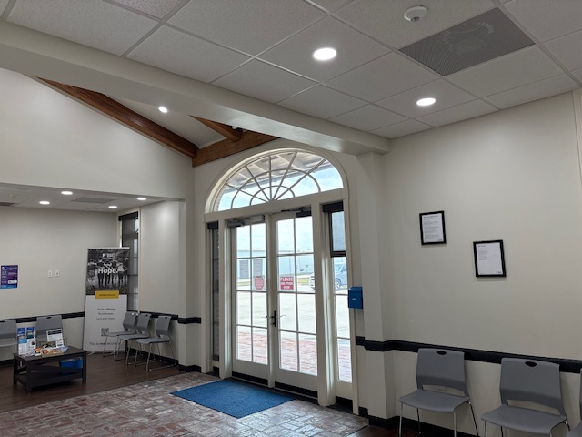 Main entrance lobby with seating and glass front doors