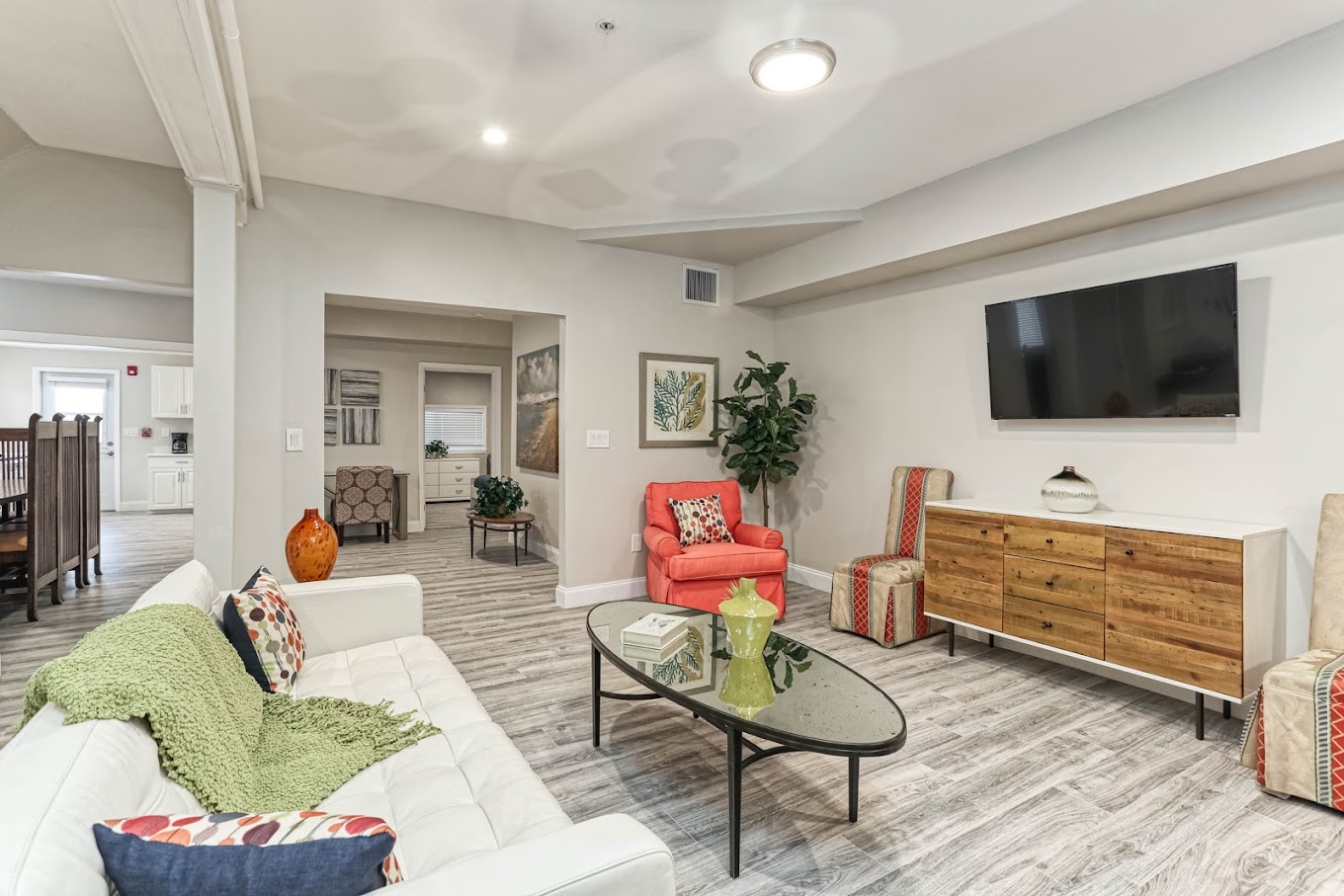 Rehab lounge with modern furniture and mounted TV