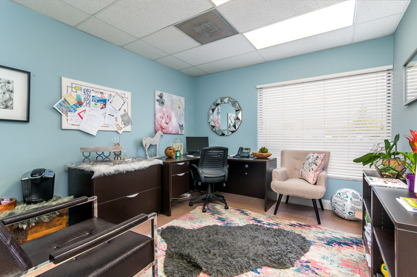 Threapy room with seating and a bulletin board.