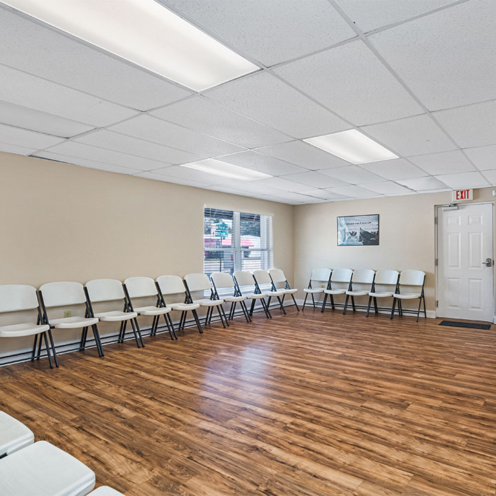 Group therapy room with chairs along the wall.