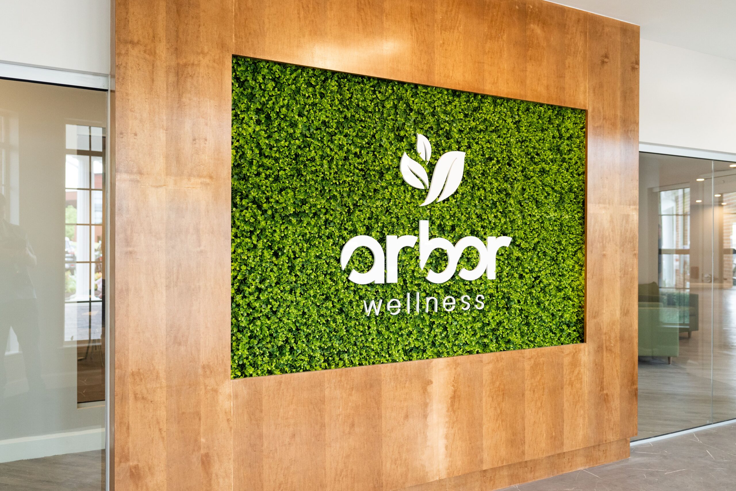 Arbor wellness signage at entrance to facility.