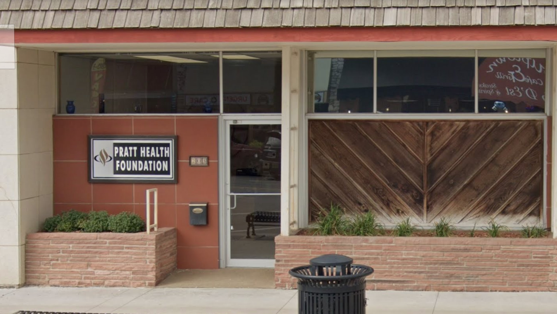 Door to Pratt Community Health Clinic with signage.