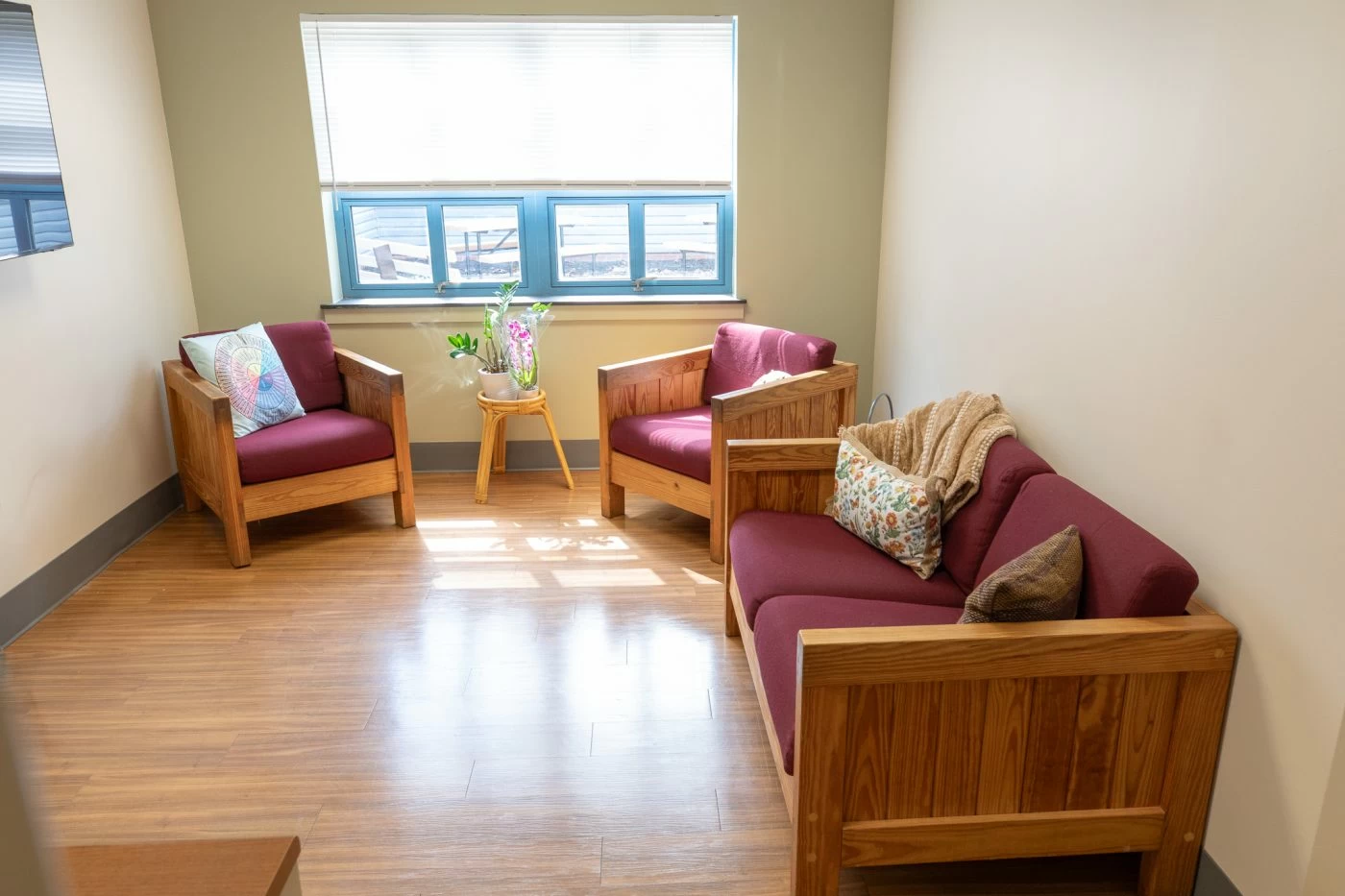 Lounge with sofas, chairs, and natural light
