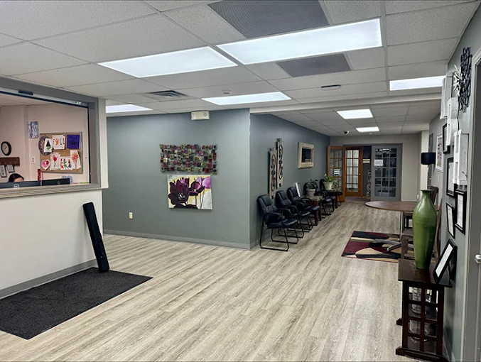 Modern hallway with seating and artwork