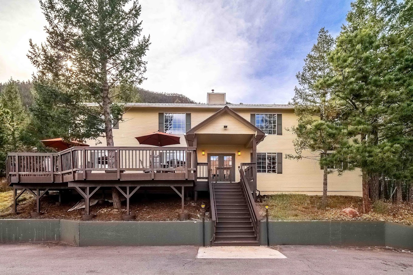 Exterior facility view with parking and entrance stairwell.